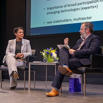 Alondra Nelson and Andrew Papachristos sitting on stage