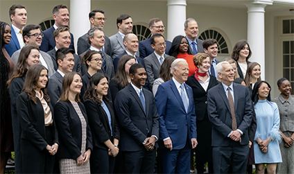 image of Kirabo Jackson in front of White House with other members of Council of Economic Advisers