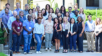 CRT workshop attendees standing in front of a building for a group photo