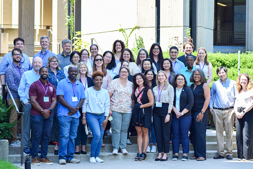 CRT workshop attendees standing in front of a building for a group photo