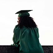 woman wearing graduation cap and gown