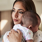 Hispanic mother holding her baby