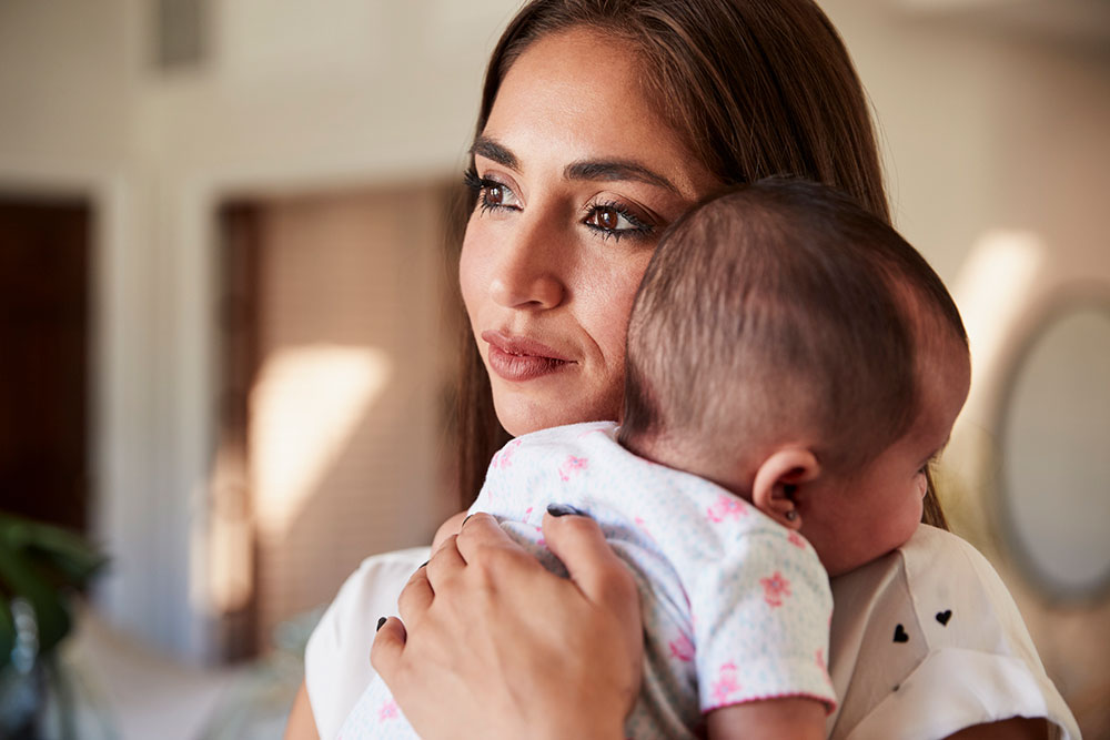 Hispanic mother holding her baby