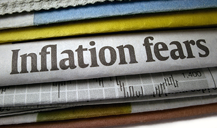 image of a stack of newspapers with the headline "inflation fears"