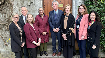 Picture of researchers in front of a door