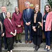 Picture of researchers in front of a door