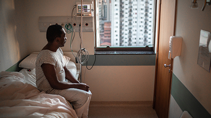 man sitting on a hospital bed