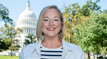 Stephanie DeLuca in front of the Capitol building