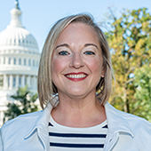 Stephanie DeLuca in front of the Capitol building