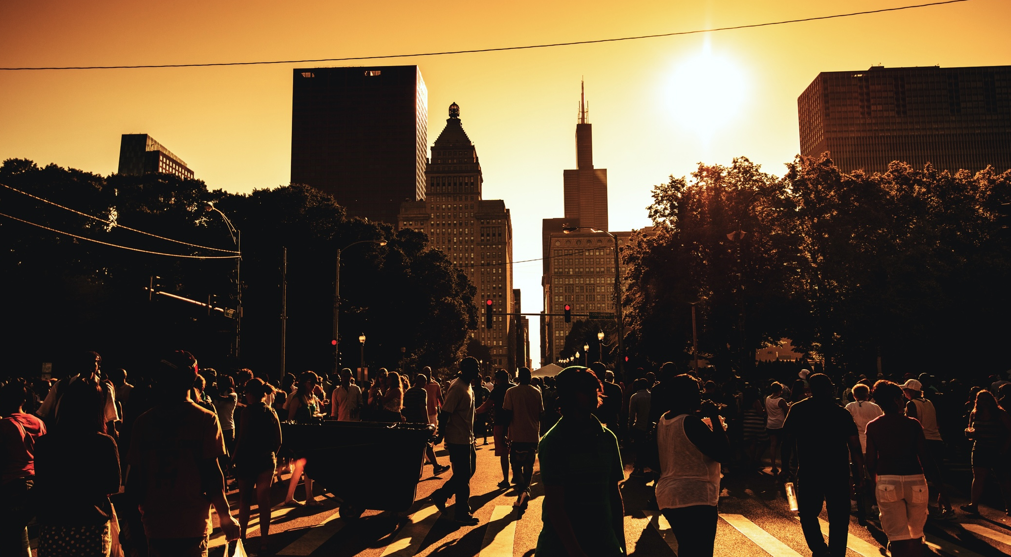 a crowded street in downtown Chicago on a hot summer day