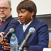 Panelist speaking into a microphone